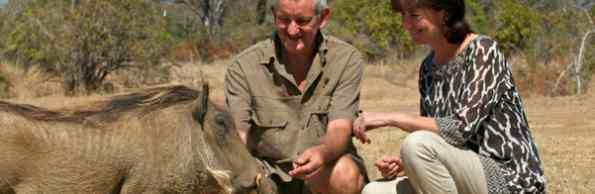 Steve and Anna Tolan and semi-resident Roxy the warthog